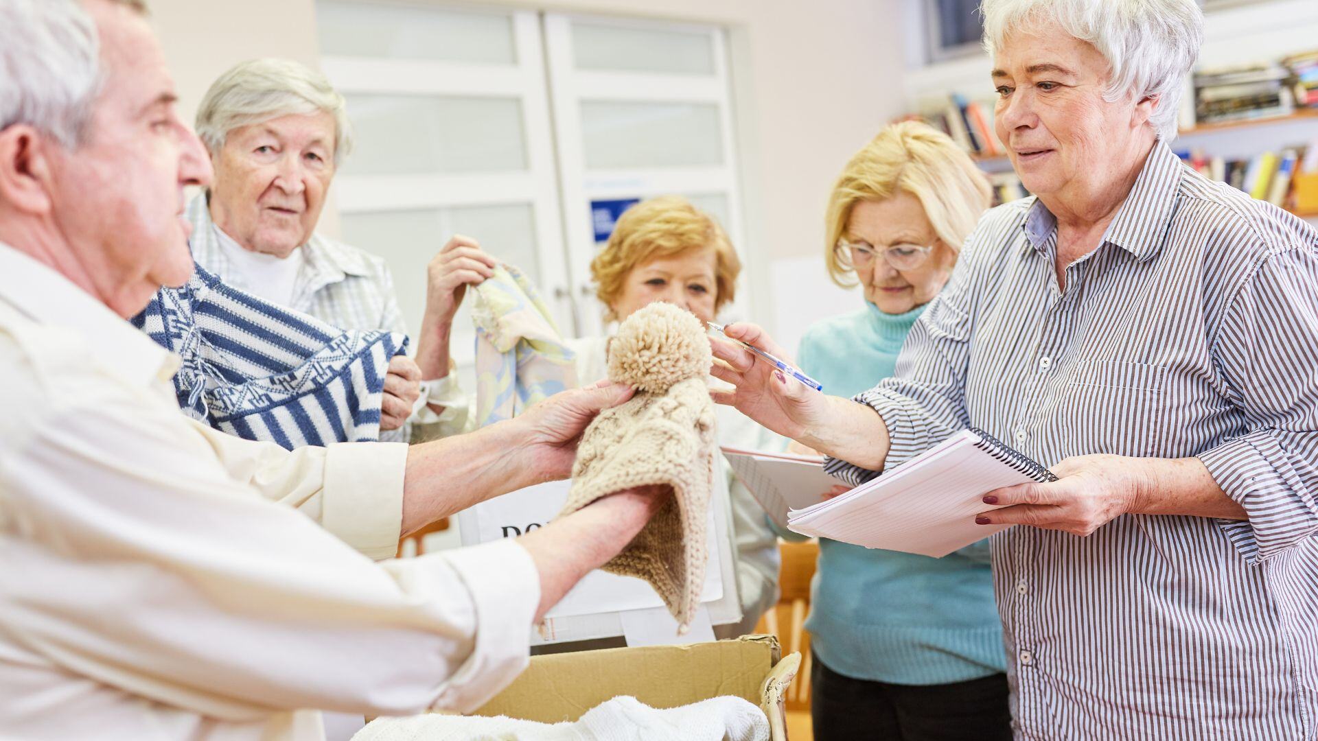 Senior volunteers sorting donations 